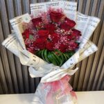 Love Letter Roses: Red Blooms in Script Wrap