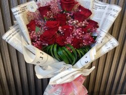 Love Letter Roses: Red Blooms in Script Wrap